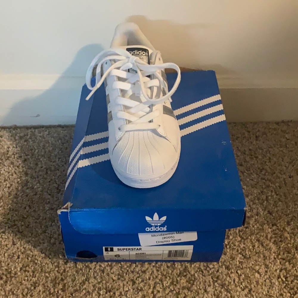 All white adidas superstar sneakers
